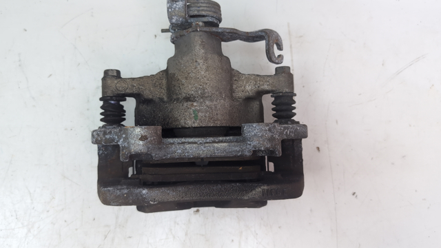 Задній гальмівний супорт лівий FR3Z2553J FORD