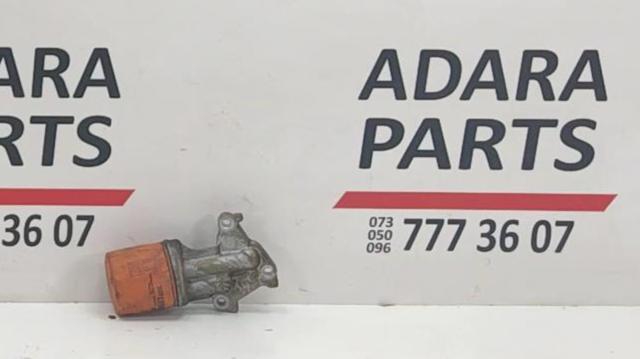 Корпус масляного фільтра PE0114311 MAZDA