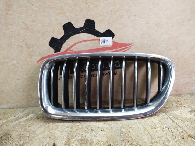 Решітка радіатора ліва 7412323 BMW