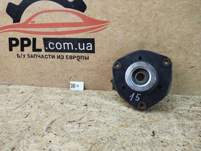 Подушка амортизатора переднього 7N0412331 VAG
