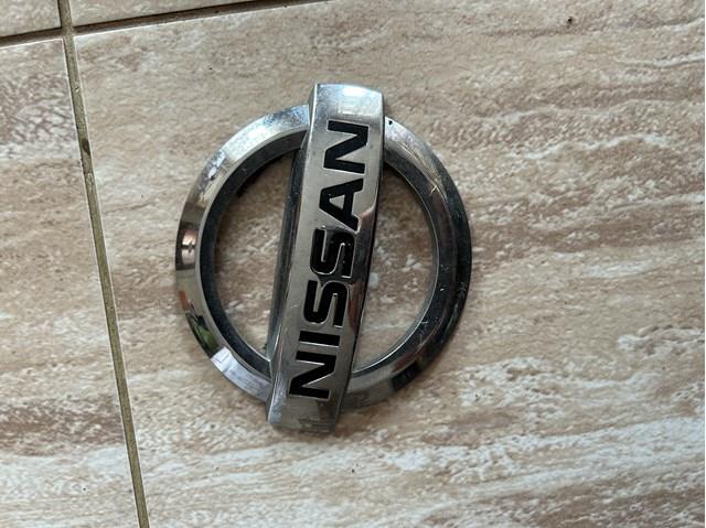 Емблема на кришку багажника, фірм.значок 848904CL0A NISSAN
