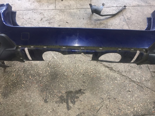 Кожух бампера заднього 57704AL130 SUBARU