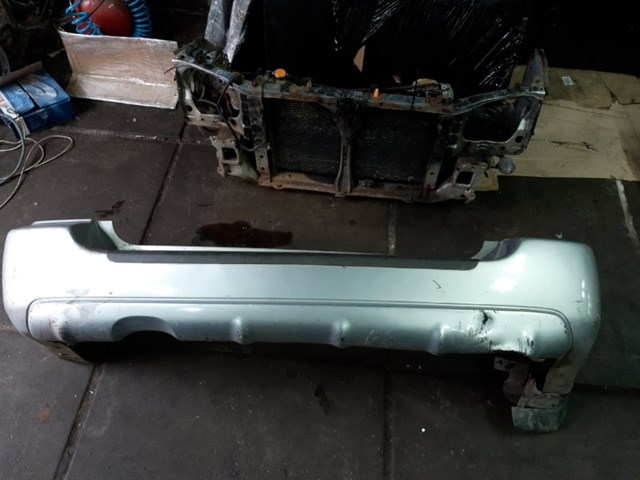 Кожух бампера заднього 57704SA010 SUBARU