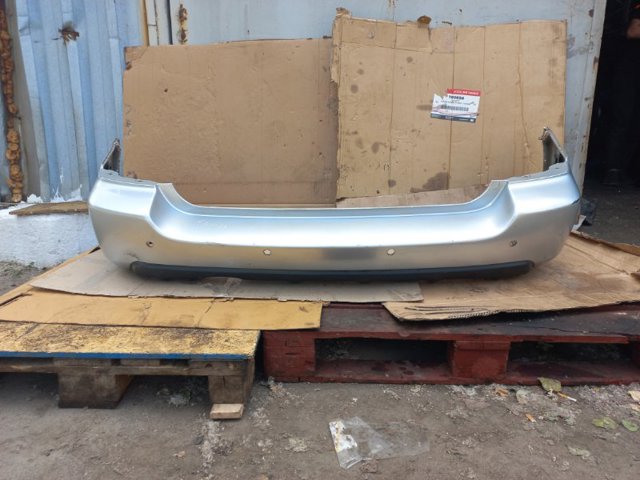 Бампер задній 57704SA012 SUBARU