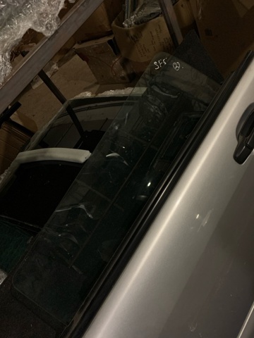 Скло заднє ліве 63210FC111 SUBARU