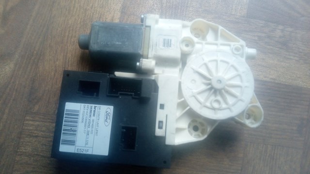 Мотор склопідйомника дверей передніх, лівих 1430347 FORD