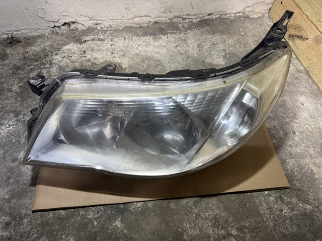 Блок фара ліва 84001SC230 SUBARU