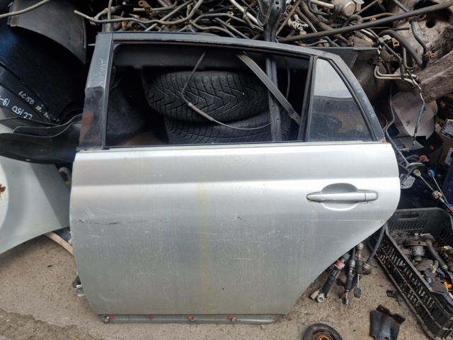 Двері задні, ліві 67004AC040 TOYOTA