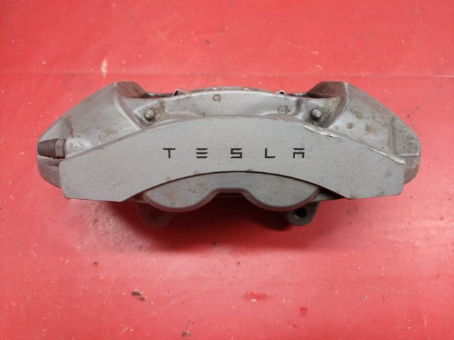 Супорт гальмівний, передній, лівий 104462100D TESLA