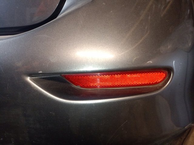 Правий відбивач бампера 26560JJ90A NISSAN