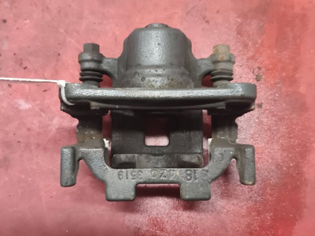 Задній гальмівний супорт лівий 440111AA0A NISSAN