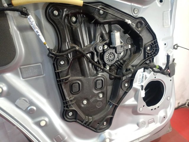 Механізм стеклопод'емника двері задньої, лівої TK4873590A MAZDA