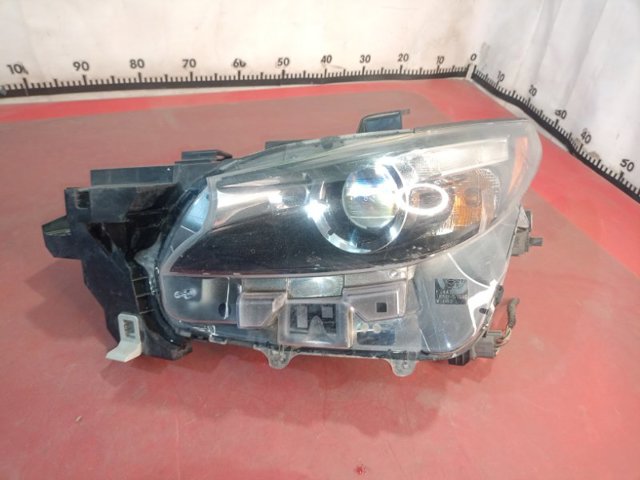 Основна фара в зборі ліва TK5051040 MAZDA