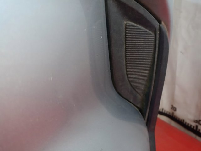 Решітка переднього бампера, ліва TK7850C21B MAZDA