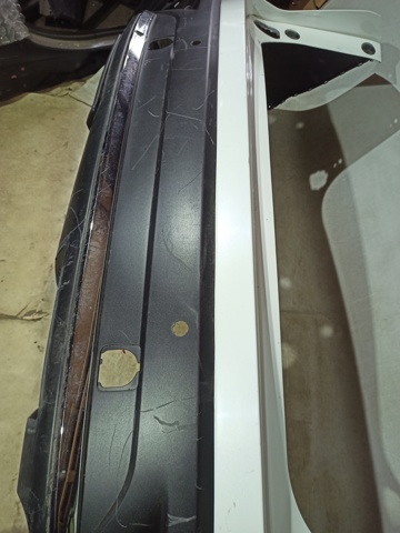 Бампер задній TK4850221 MAZDA