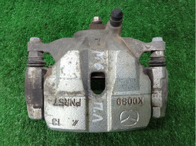 Супорт гальмівний, передній, лівий GHY93399Z MAZDA