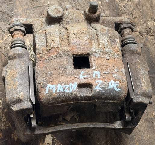 Супорт гальмівний, передній, лівий DF7133990C MAZDA