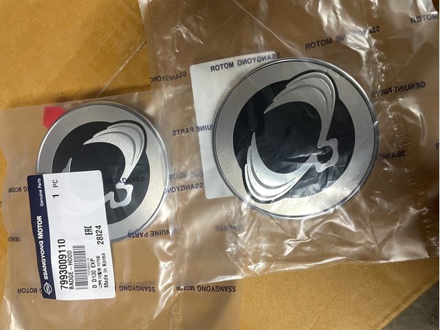 Емблема капота 7993009110 SSANG YONG