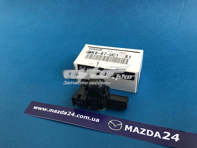 Датчик сигналізації паркування (парктронік), задній GMK667UC151 Mazda