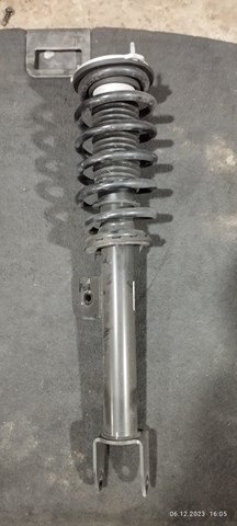 Купити 104436400G Tesla Амортизатора передній лівий