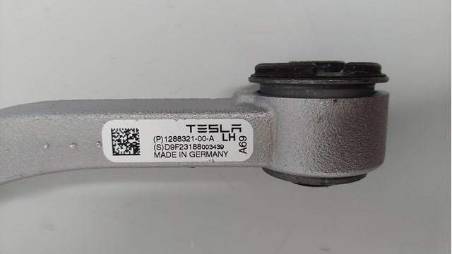 128832100A Tesla Важіль передньої підвіски верхній, лівий