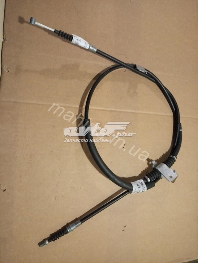 1064001077 Geely Трос ручного гальма задній, правий