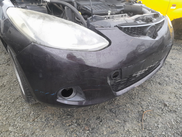 Бампер передній Mazda D65150031