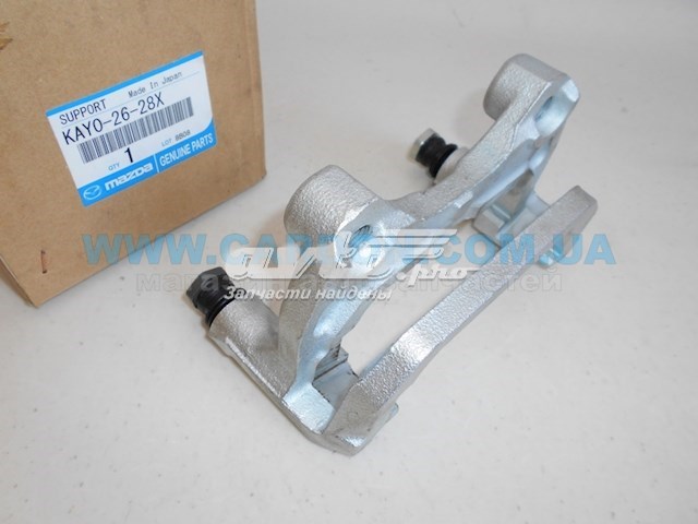 Купити KAY02628X Mazda Скоба супорту заднього
