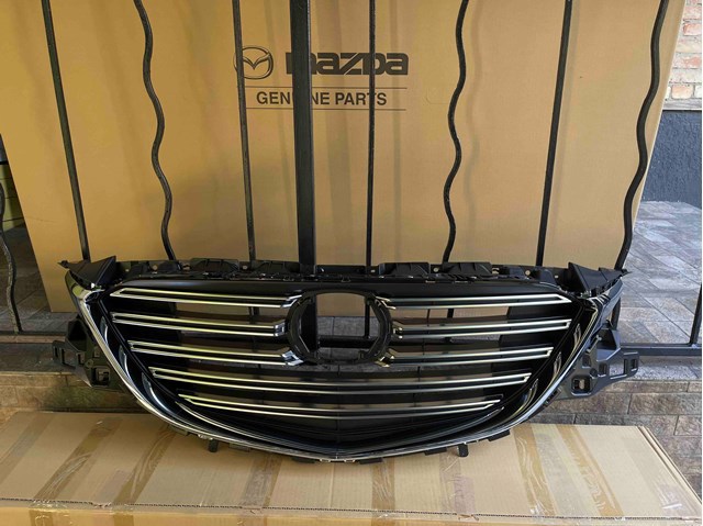 Купити TK4950710J Mazda Захисна решітка радіатора