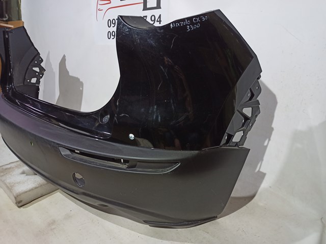 Бампер задній Mazda DFR550221