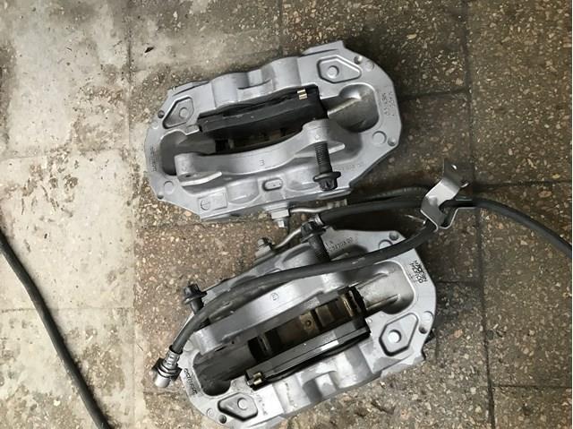 104462200D Tesla Супорт гальмівний передній правий