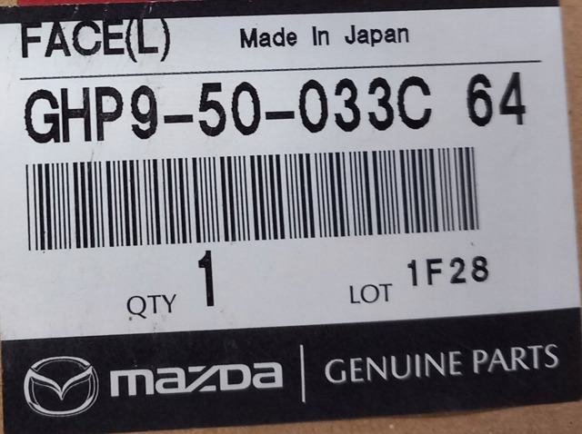 GHP950033C64 Mazda Молдинг решітки радіатора, верхній