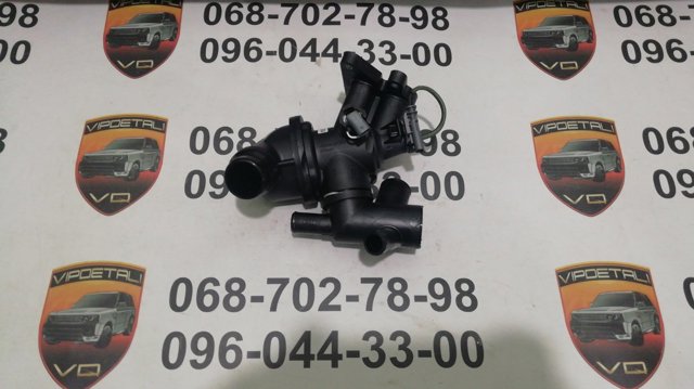 LR073694 Land Rover Корпус термостата в зборі