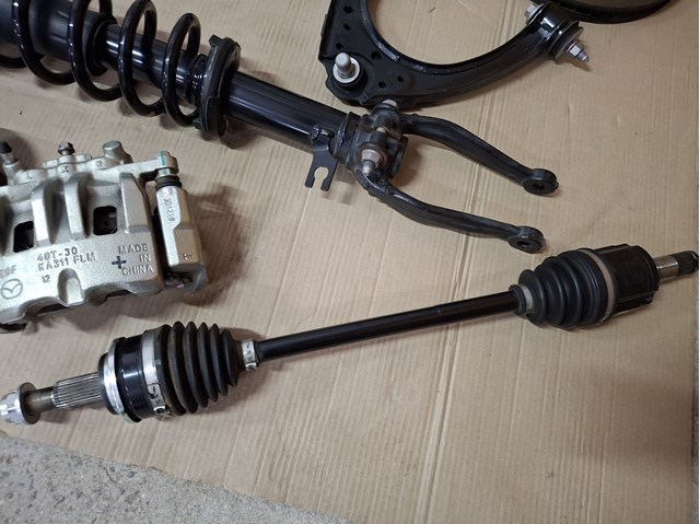 Привід передній лівий Mazda FD052560X ціна, від 361.06 USD