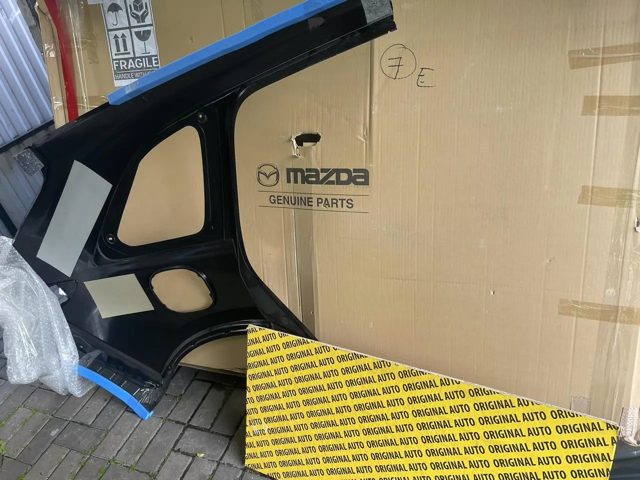 Крило заднє Mazda KMY671410 ціна, від 798.13 USD