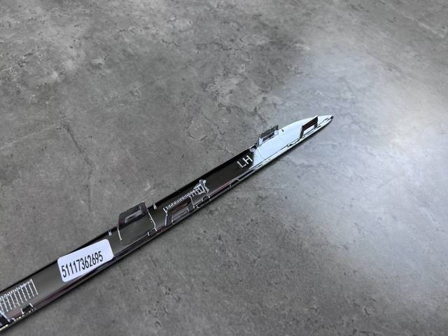 PBM99230MAL Signeda Молдинг решітки переднього бампера, лівий
