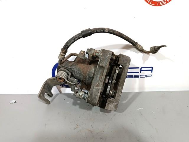 Супорт задній правий D1Y12698Z Mazda