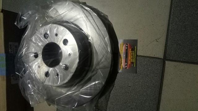 Гальмівні диски передні 104461100D Tesla
