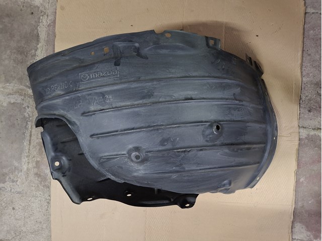 Підкрилок переднього крила, лівий Mazda VA4056140 ціна, від 58.54 USD
