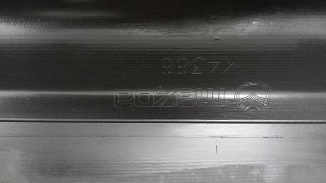 Бампер задній Mazda GAJ750221