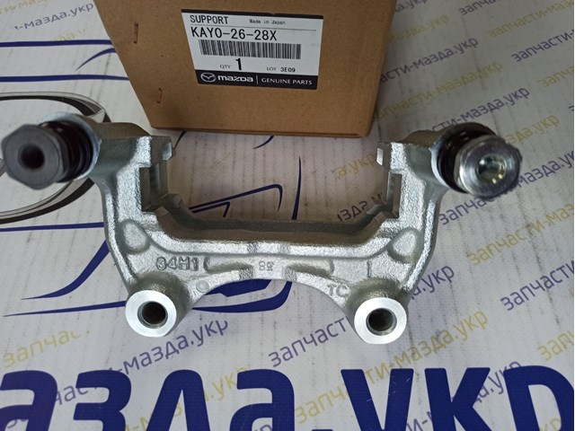 Скоба супорту заднього KAY02628X Mazda
