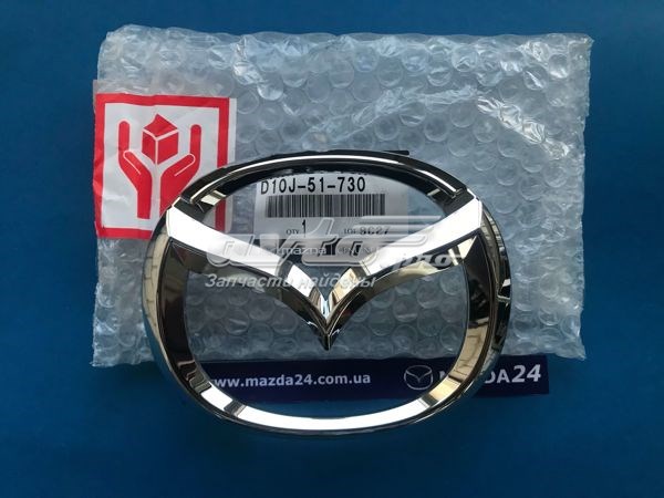 Купити D10J51730 Mazda Емблема решітки радіатора