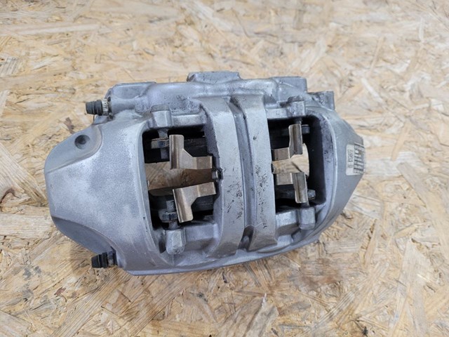 Супорт гальмівний передній лівий 118862100B Tesla