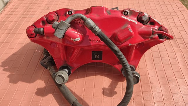 100779501D Tesla Супорт гальмівний передній правий