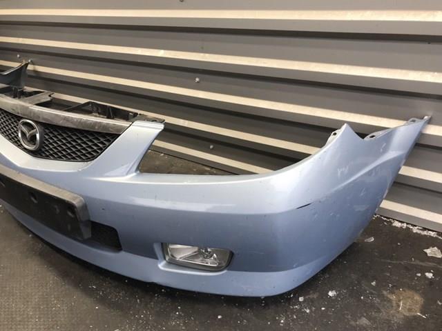 Передній бампер B30K50031 Mazda