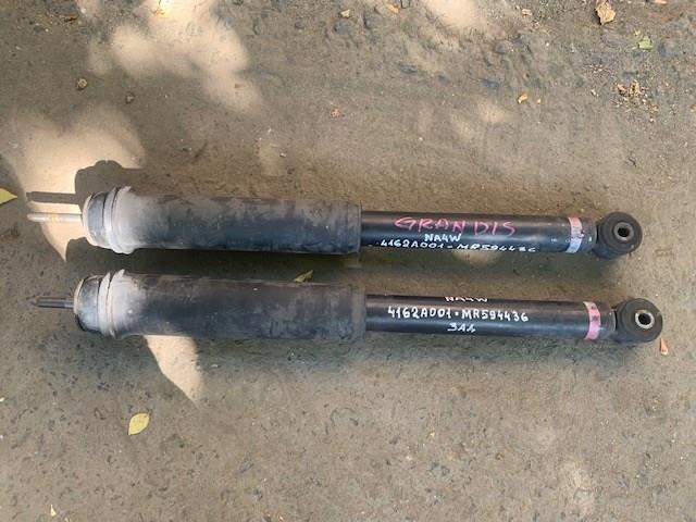 Купити MR594436 Mitsubishi Стійка амортизатора задня