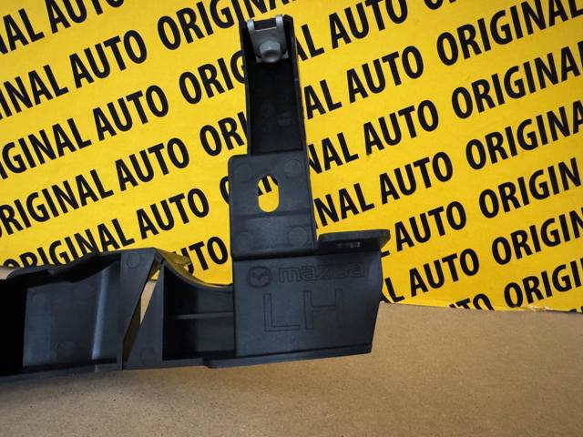 Купити DFR550160D Mazda Кронштейн-адаптер кріплення фари передньої, лівою