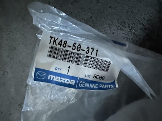 Купити TK4850371 Mazda Накладка бампера заднього, ліва