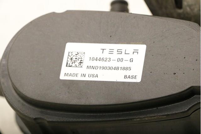 104462300G Tesla Супорт гальмівний задній лівий