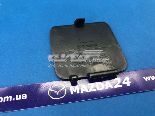 Заглушка бампера буксирувального гака, задня Mazda TK4850EL1 ціна, від 2.78 USD